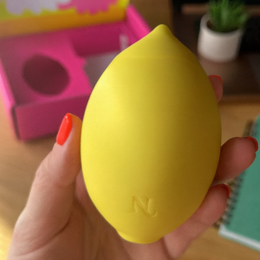 Nancy Lem held in hand with pink gift box — premium unboxing experience